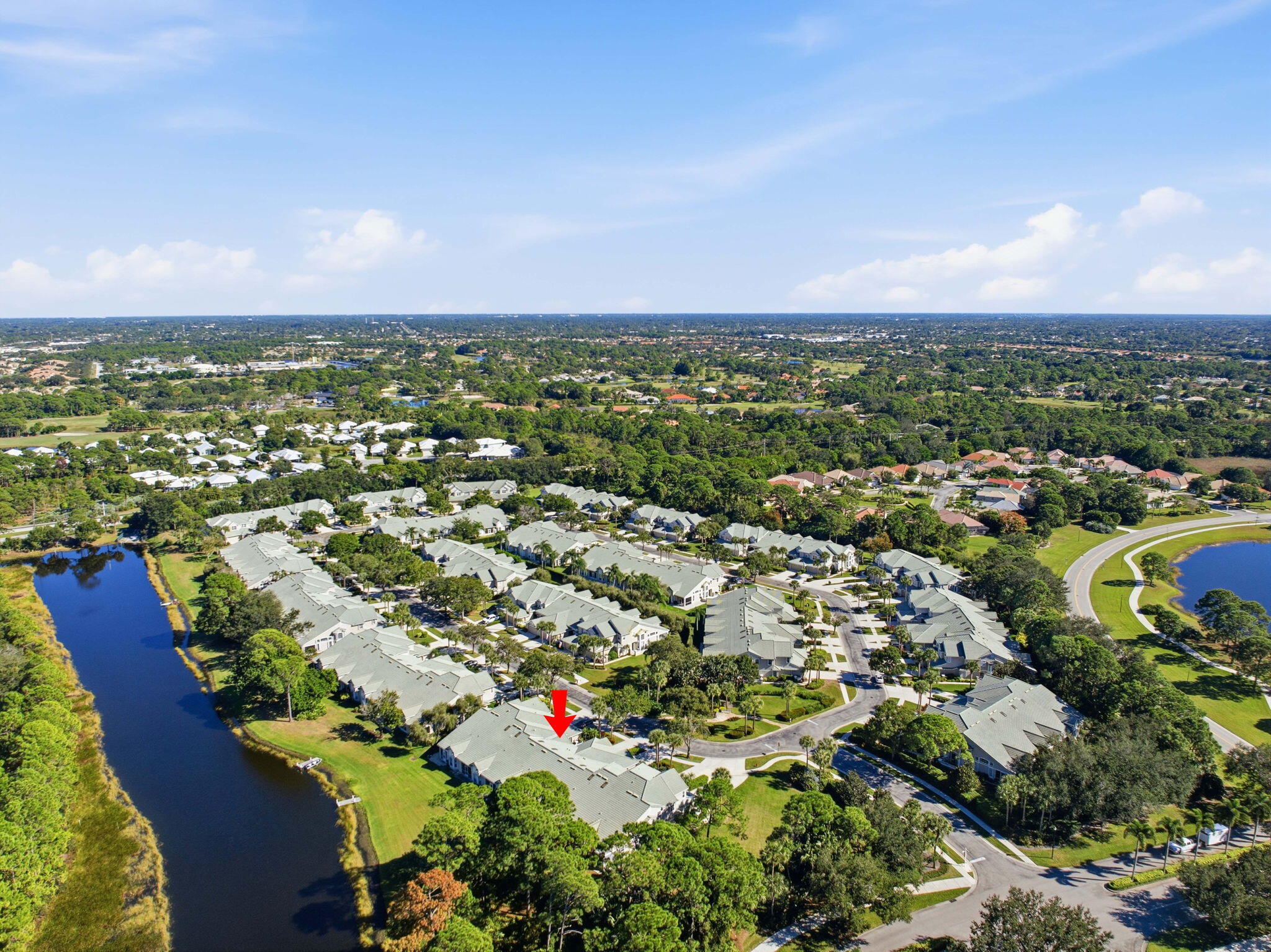 1632 Southwest Harbour Isles Circle, Unit 88 Port St. Lucie, FL 34986 - Photo 28 of 36 an aerial view of residential houses with outdoor space