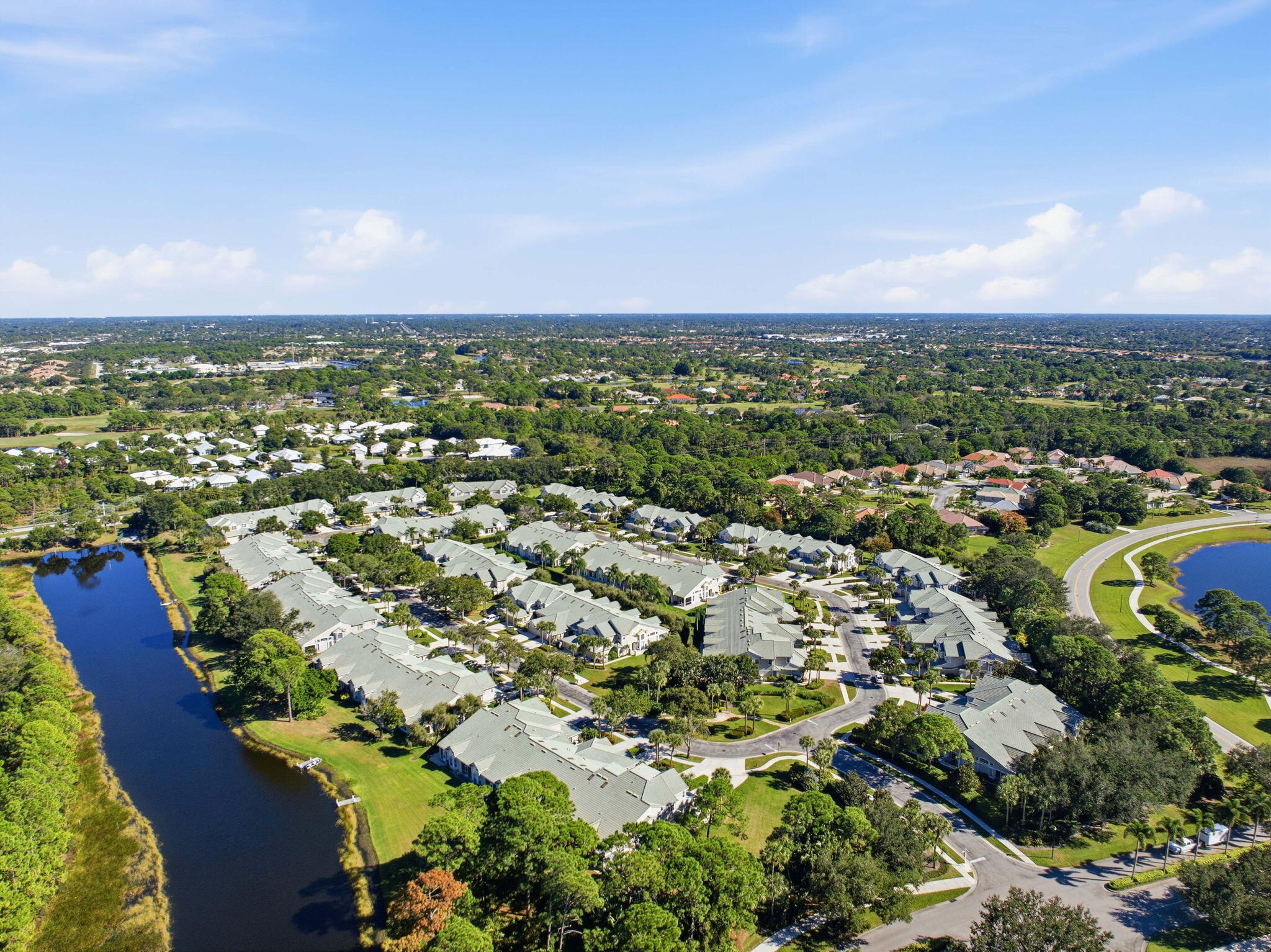 1632 Southwest Harbour Isles Circle, Unit 88 Port St. Lucie, FL 34986 - Photo 29 of 36 an aerial view of residential houses with outdoor space