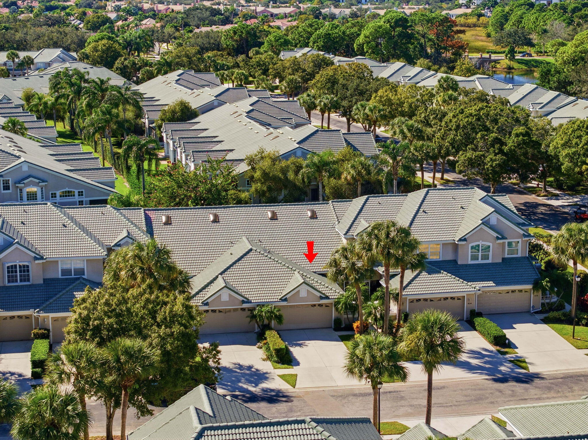 1632 Southwest Harbour Isles Circle, Unit 88 Port St. Lucie, FL 34986 - Photo 32 of 36 an aerial view of multiple houses with yard