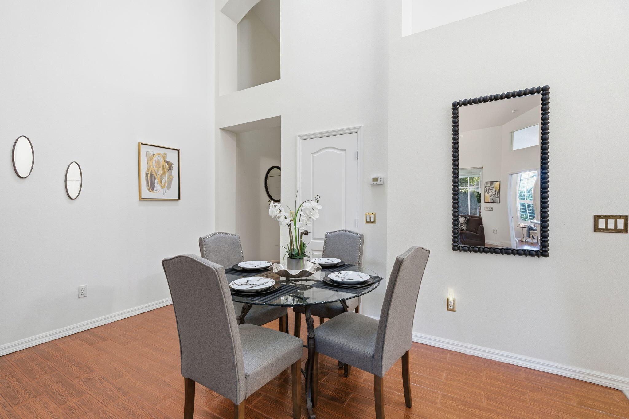 1632 Southwest Harbour Isles Circle, Unit 88 Port St. Lucie, FL 34986 - Photo 7 of 36 a view of a dining room with furniture and wooden floor