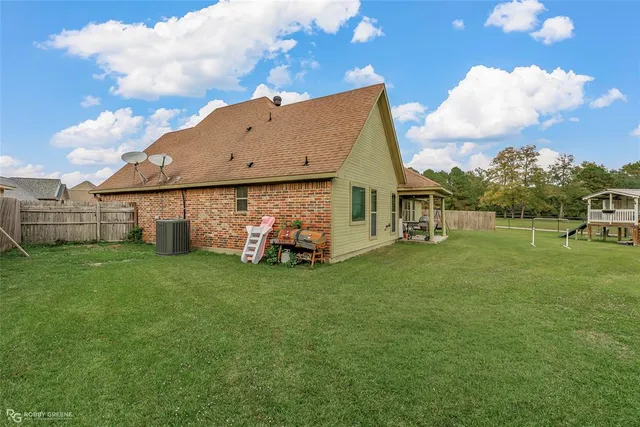 a view of a house with a back yard