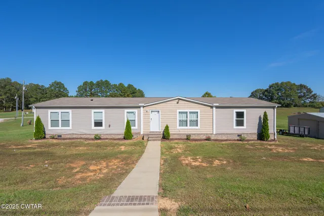 a view of a house with a big yard