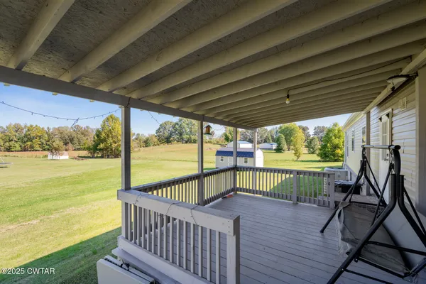 a view of a balcony with wooden floor
