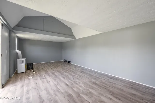 a small garden covered with tall trees