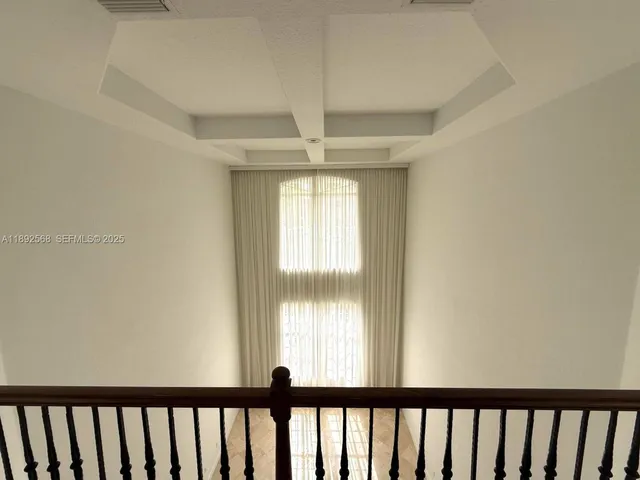a living room with stainless steel appliances kitchen island granite countertop furniture and a view of kitchen