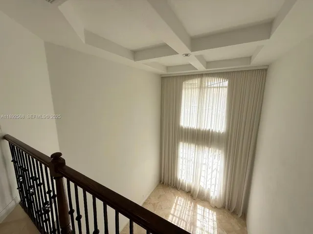 a view of an empty room and window