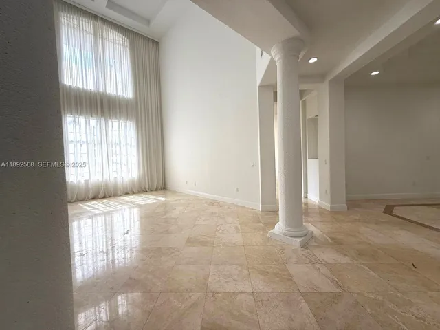 a kitchen with stainless steel appliances granite countertop a sink and a stove