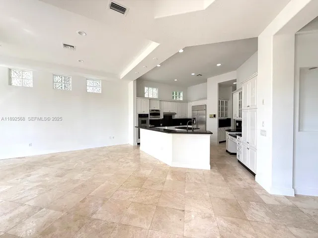 a room with walk in closet and window