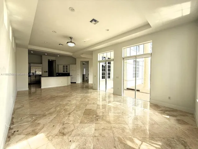 a bathroom with a tub a sink and mirror