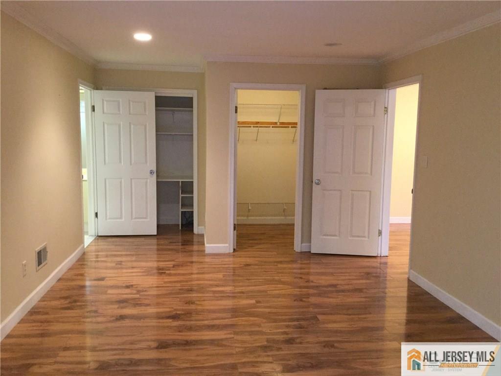 2803 Ridgefield Court Helmetta, NJ 08828 - Photo 4 of 20 a view of empty room with wooden floor