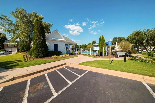 a view of a house with a yard and plants