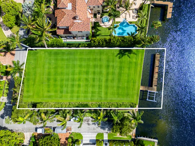 a view of a lake with a building in the background