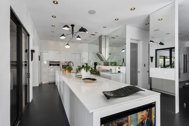 a bathroom with a glass shower door