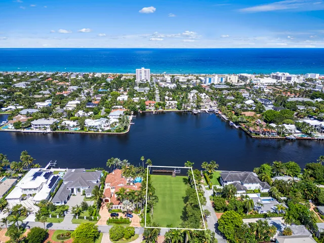a view of a house with backyard sitting area and garden