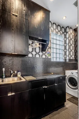 a view of a patio with couches chairs potted plants and floor to ceiling window