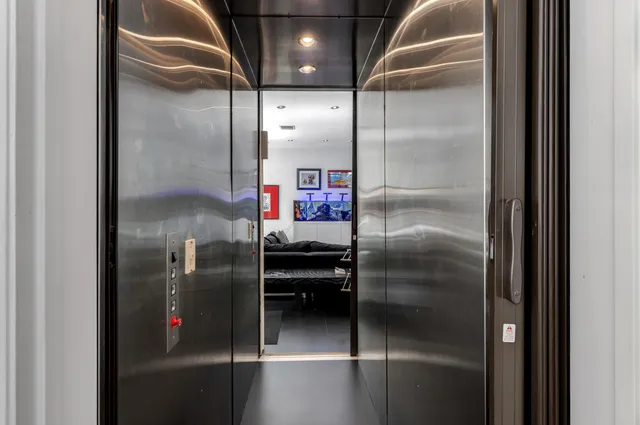 a view of a patio with couches chairs potted plants and floor to ceiling window