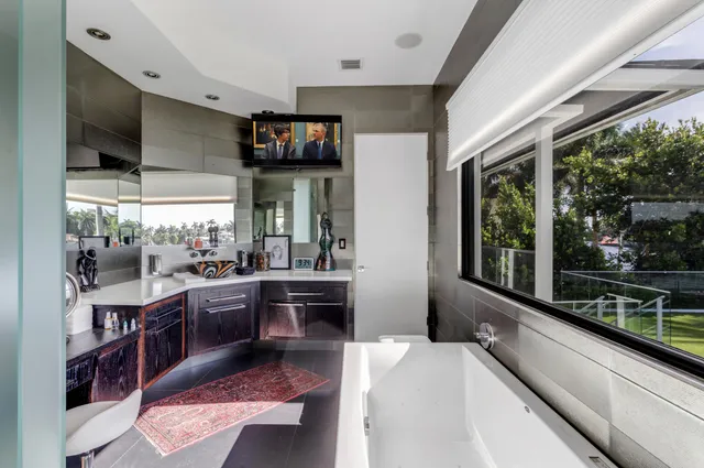 a front view of a house with swimming pool yard and outdoor seating