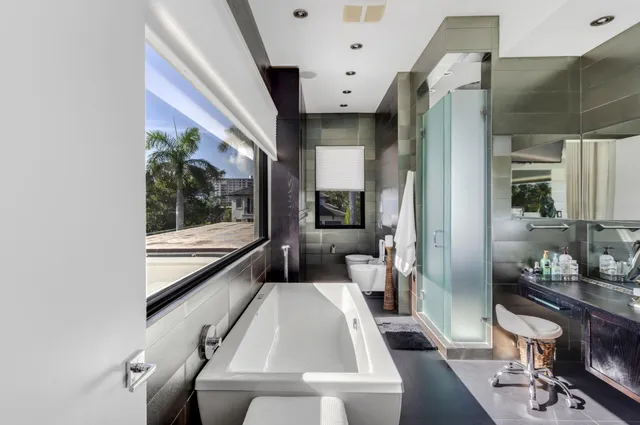 a view of a swimming pool with outdoor seating