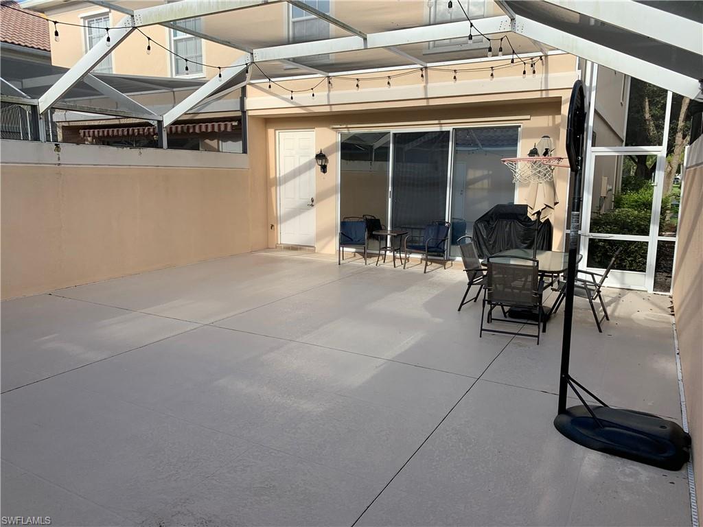 3518 Zanzibar Way Naples, FL 34119 - Photo 11 of 13 a view of a building with sitting area