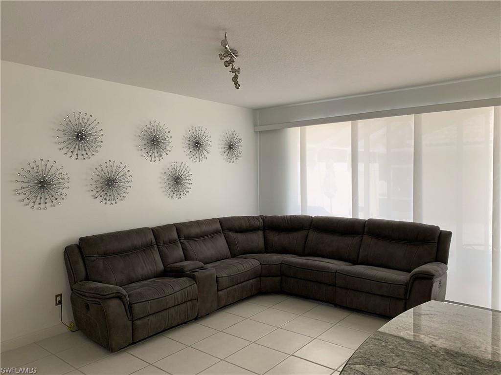 3518 Zanzibar Way Naples, FL 34119 - Photo 4 of 13 a living room with furniture and a window