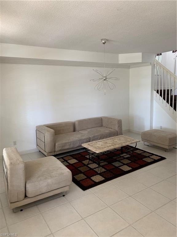3518 Zanzibar Way Naples, FL 34119 - Photo 6 of 13 a living room with furniture