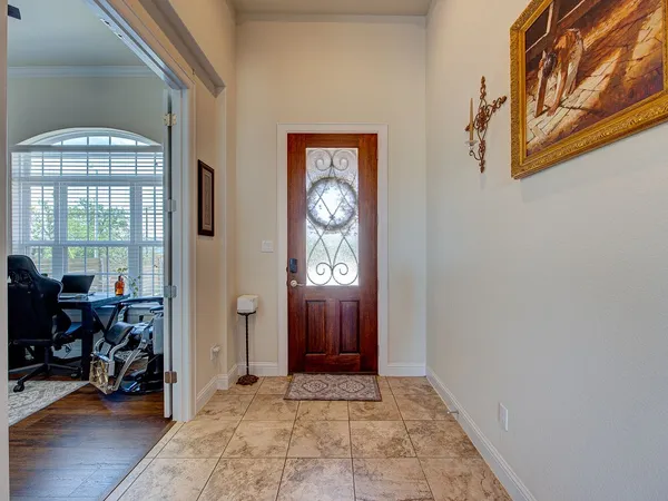 a view of an entryway with wooden floor