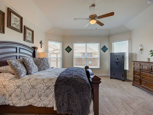 a bed room with a bed and a window
