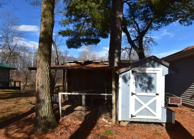 a backyard of a house with lots of green space