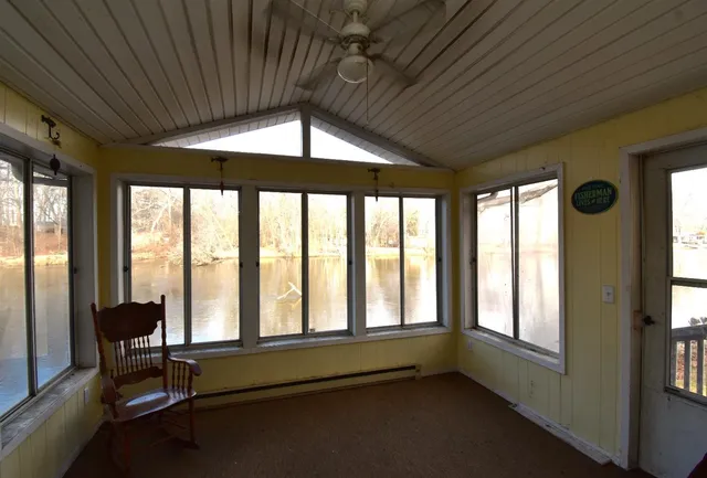 a room with gym equipment and a large window