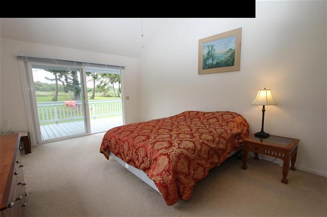215 Maia Road Hana, HI 96713 - Photo 15 of 23 a bed sitting in a bedroom next to a window