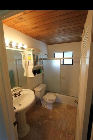 215 Maia Road Hana, HI 96713 - Photo 17 of 23 a bathroom with a sink a toilet and shower