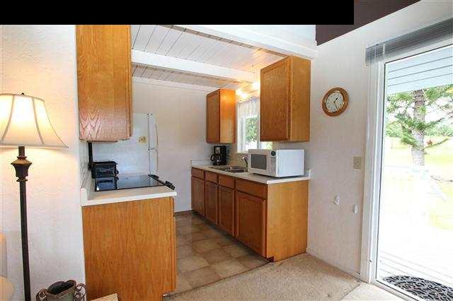 215 Maia Road Hana, HI 96713 - Photo 10 of 23 a kitchen with stainless steel appliances granite countertop a sink a stove and a refrigerator