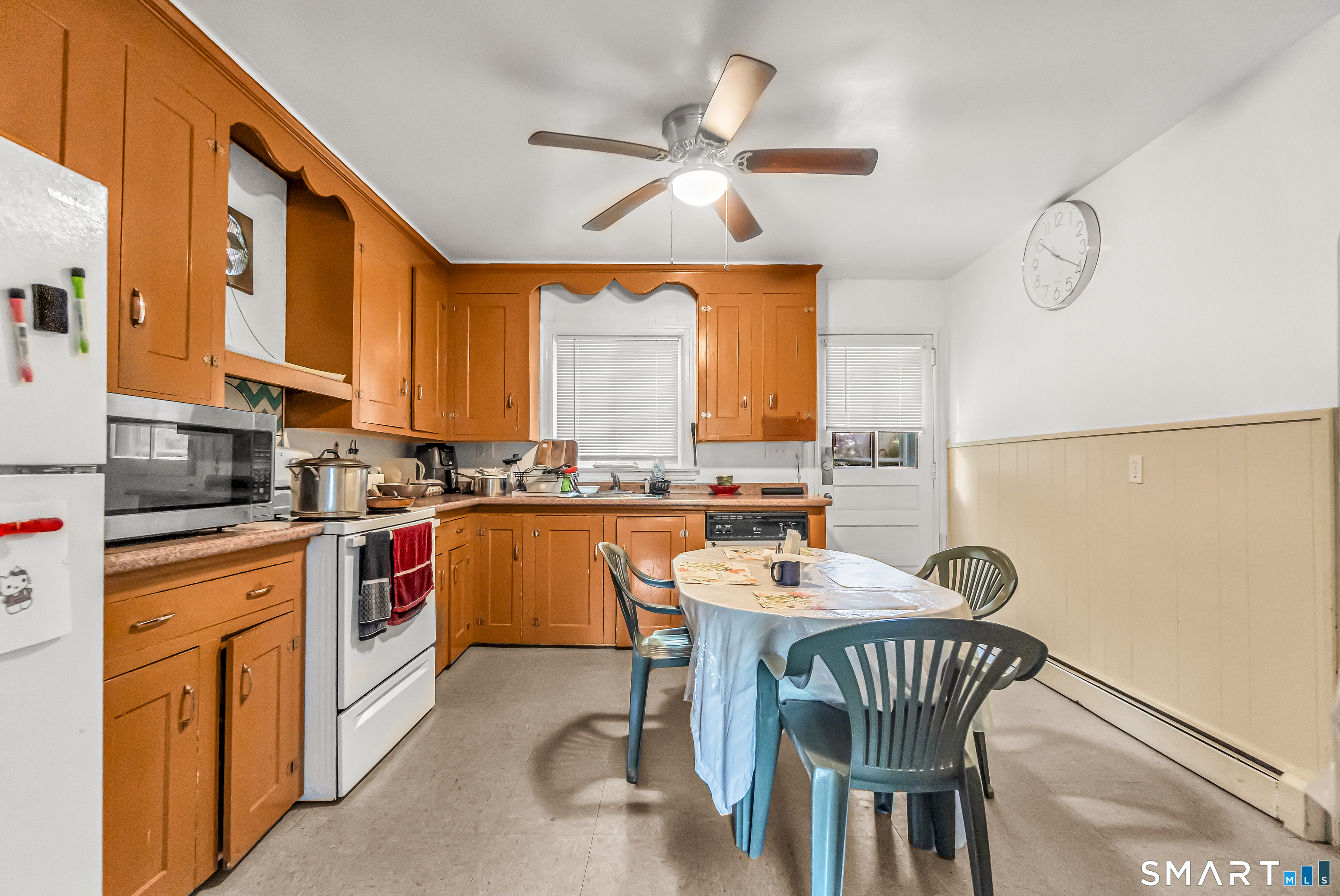 214 Thames Street New London, CT 06320 - Photo 11 of 33 a kitchen with stainless steel appliances granite countertop a stove a sink dishwasher and a refrigerator with wooden floor
