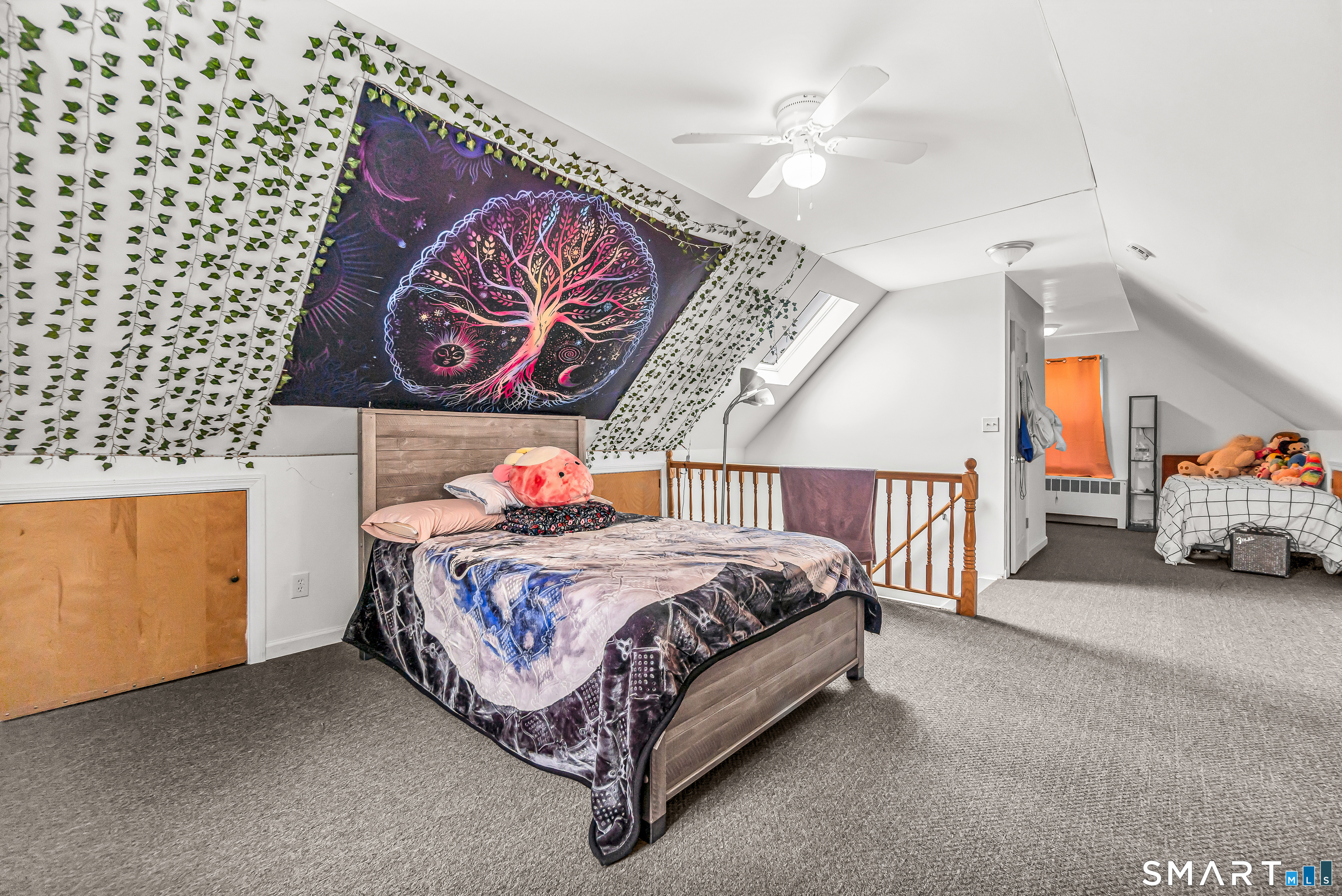 214 Thames Street New London, CT 06320 - Photo 15 of 33 a bedroom with a bed and a chandelier