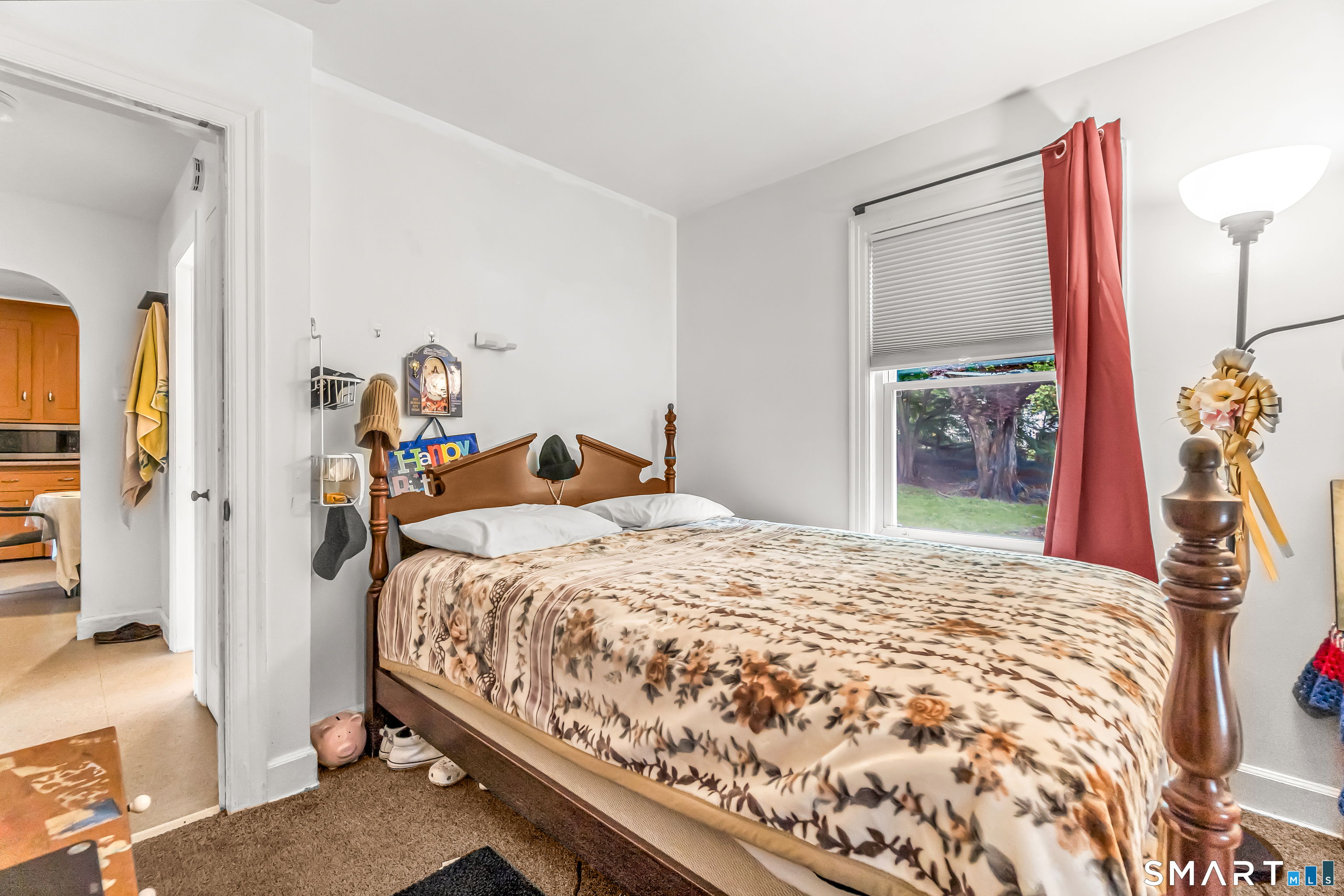 214 Thames Street New London, CT 06320 - Photo 24 of 33 a bedroom with a bed and a chandelier