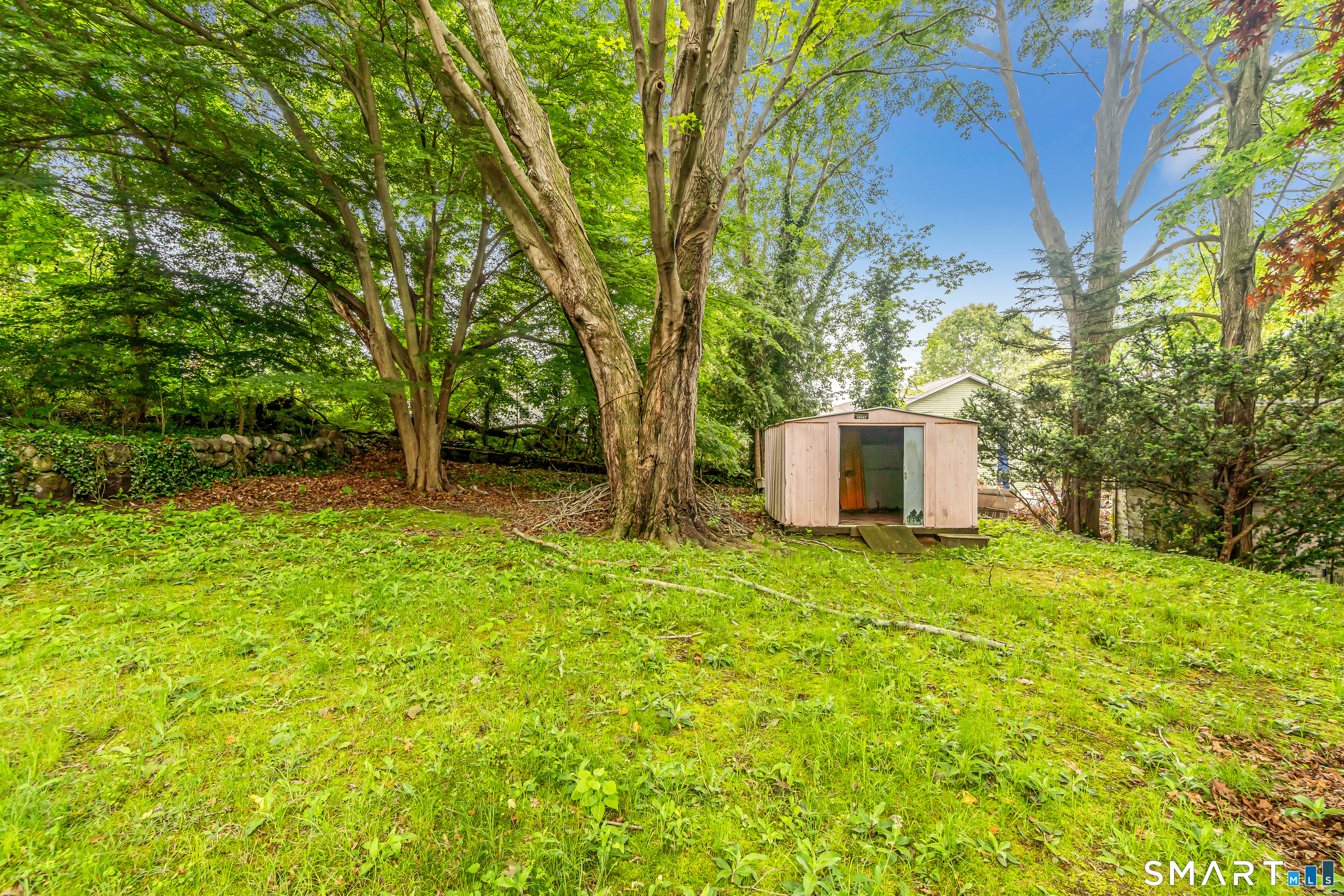 214 Thames Street New London, CT 06320 - Photo 33 of 33 a backyard of a house with a garden and entertaining space