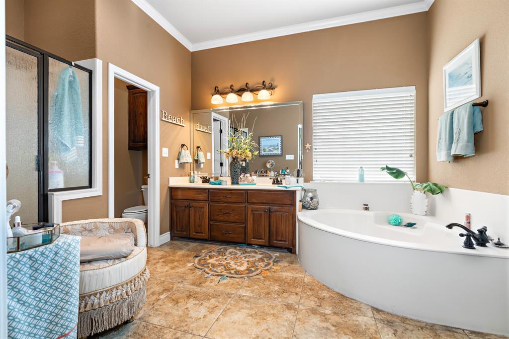 845 County Line Road West West, TX 76691 - Photo 16 of 38 a bathroom with a tub sink and mirror