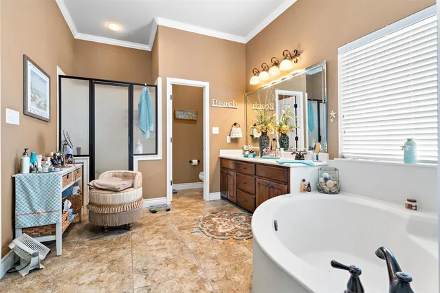 a bathroom with a tub sink and mirror