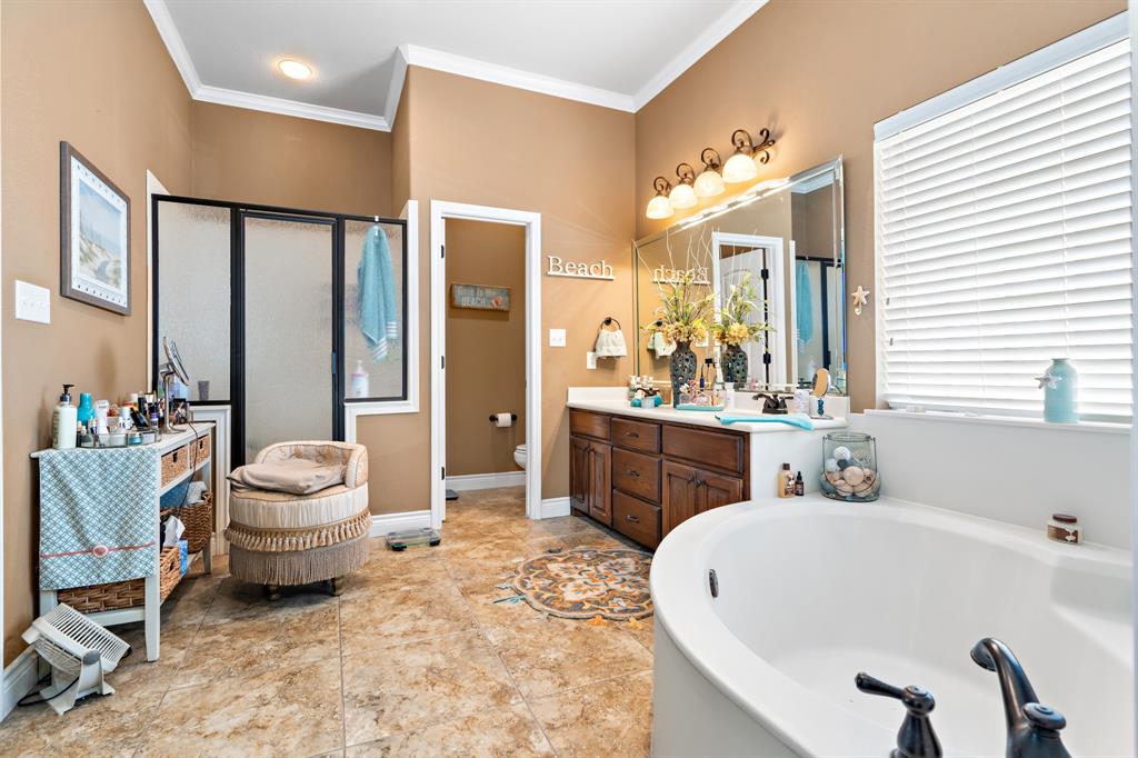 845 County Line Road West West, TX 76691 - Photo 17 of 38 a bathroom with a tub sink and mirror