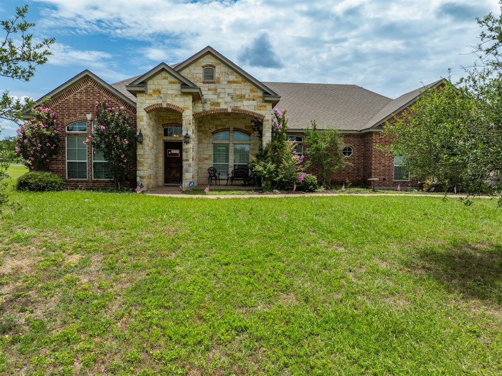 845 County Line Road West West, TX 76691 - Photo 2 of 38 a view of a big house with a big yard and large trees