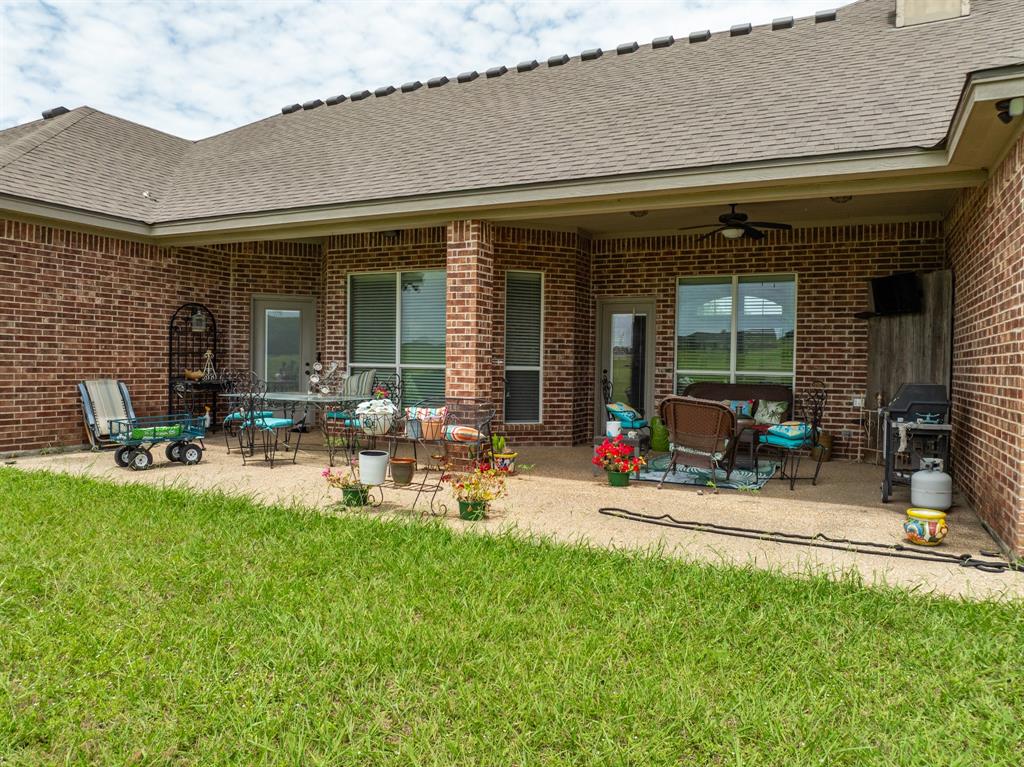 845 County Line Road West West, TX 76691 - Photo 26 of 38 a view of a house with backyard porch and sitting area