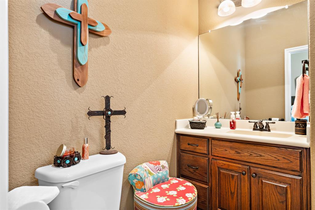 845 County Line Road West West, TX 76691 - Photo 36 of 38 a bathroom with a sink vanity mirror and toilet
