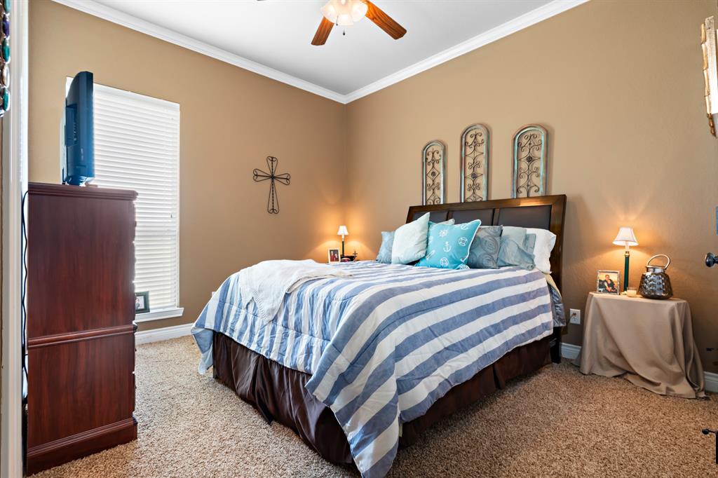 845 County Line Road West West, TX 76691 - Photo 37 of 38 a bedroom with a bed and a night stand