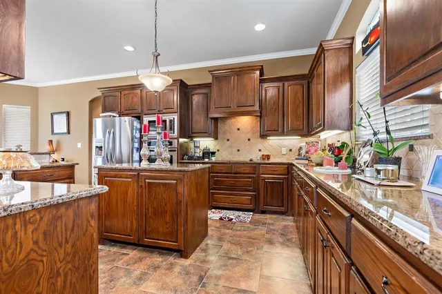 a kitchen with granite countertop lots of counter top space