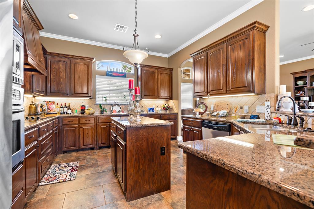 845 County Line Road West West, TX 76691 - Photo 5 of 38 a kitchen with a stove sink cabinets and refrigerator