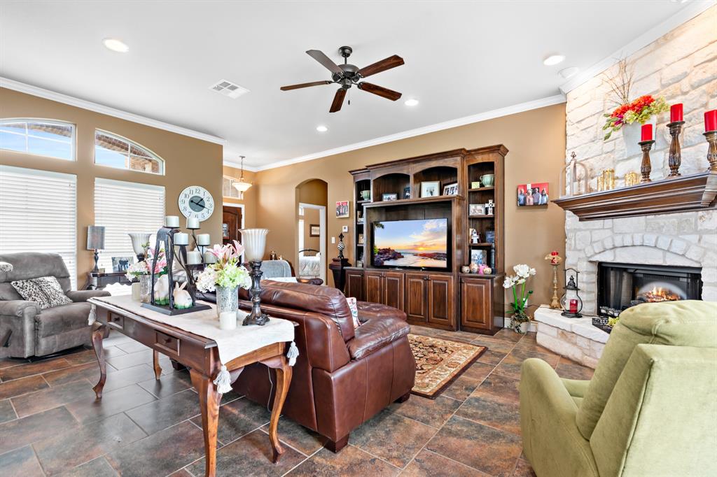 845 County Line Road West West, TX 76691 - Photo 8 of 38 a living room with furniture a fireplace and a large window
