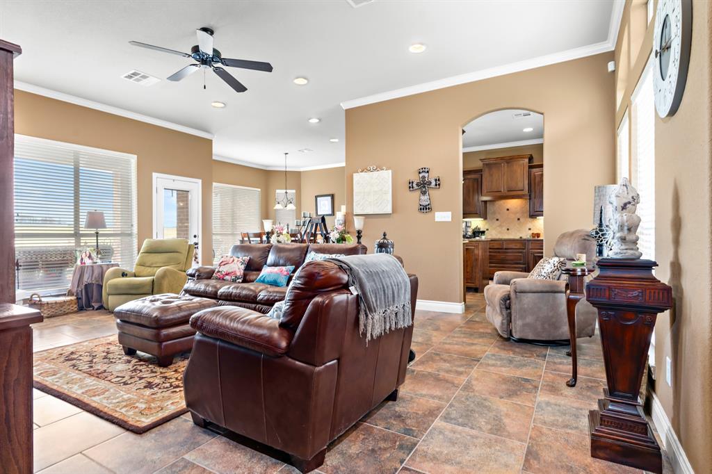 845 County Line Road West West, TX 76691 - Photo 9 of 38 a living room with furniture potted plant and a chandelier