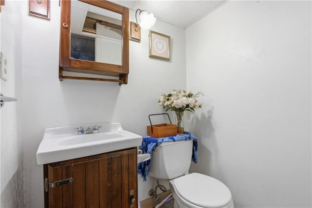 116 Hidden Valley Road Canonsburg, PA 15317 - Photo 27 of 33 Convenient lower-level powder room with easy access off of the game room and exercise room. Perfect for family and guests.