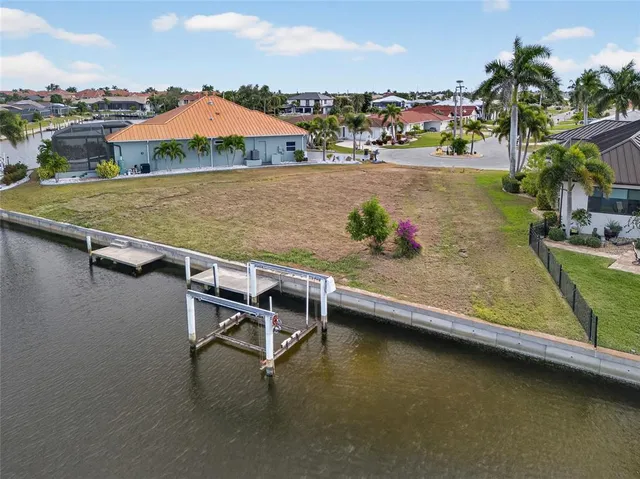 an aerial view of a house with swimming pool outdoor seating