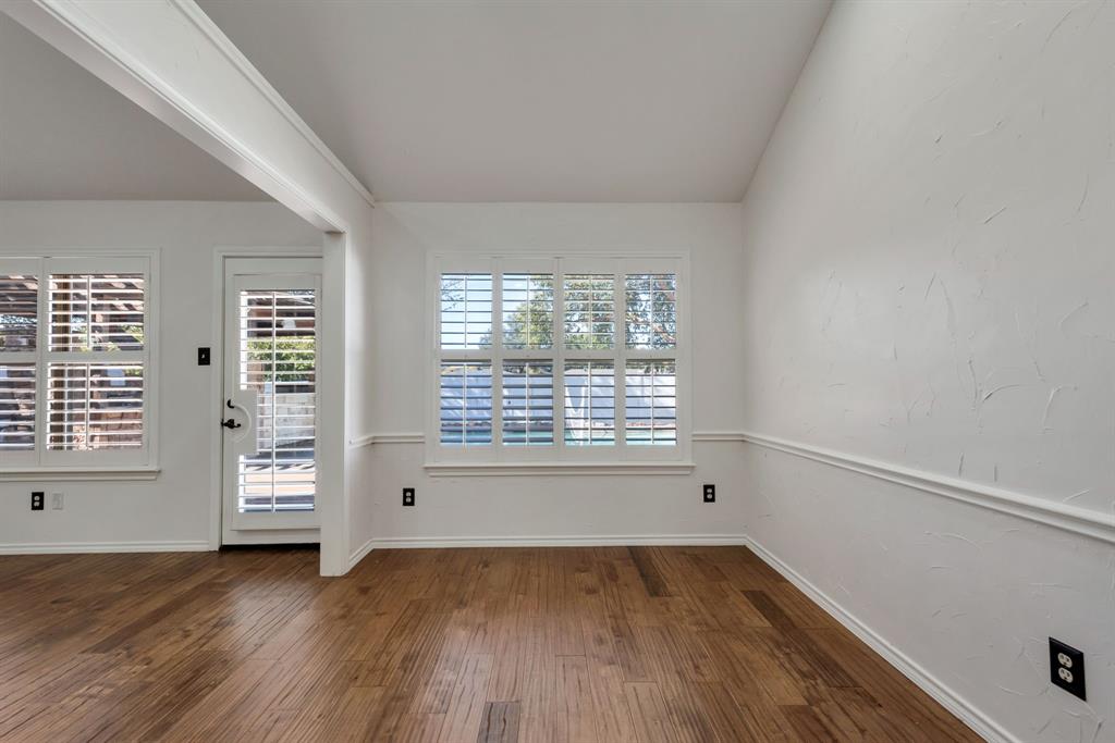 3305 Timber View Circle Bedford, TX 76021 - Photo 13 of 26 a view of an empty room with wooden floor and a window